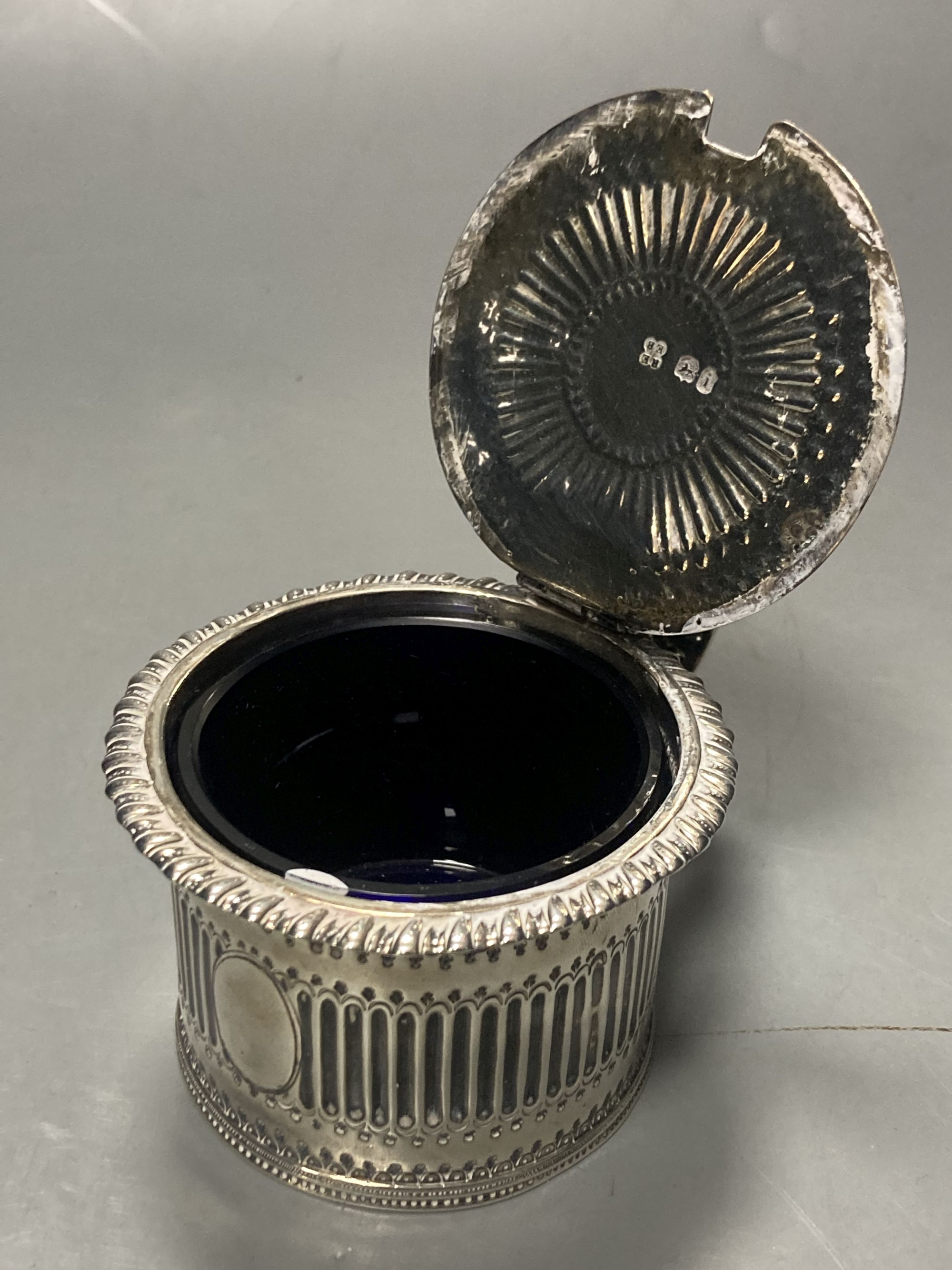 A George IV silver drum mustard, with blue glass liner, Emes & Barnard, London,1824, height 6.7cm, 145 grams.